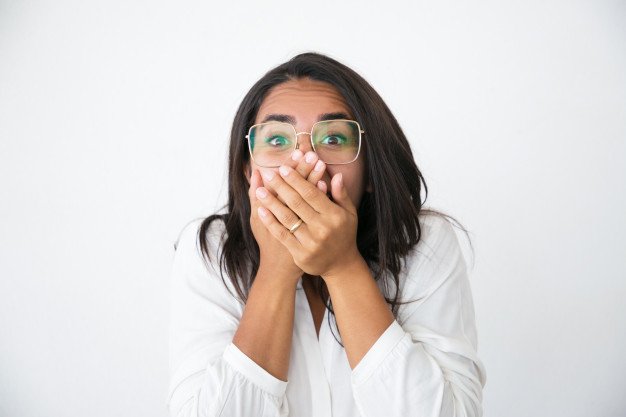 10 Stomach Bloating Remedies, Relieve your Bloating Instantly excited girl swallowing air
