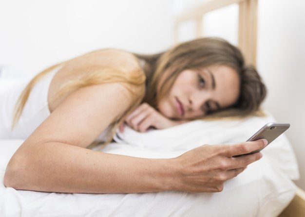 How to Fall Asleep Fast (10 Proven Effects of Sleep Deprivation) women with phone before sleep